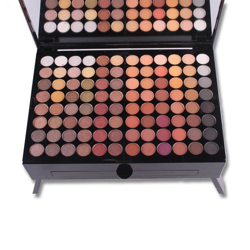 Makeup palette with various shades of eyeshadows on a white background