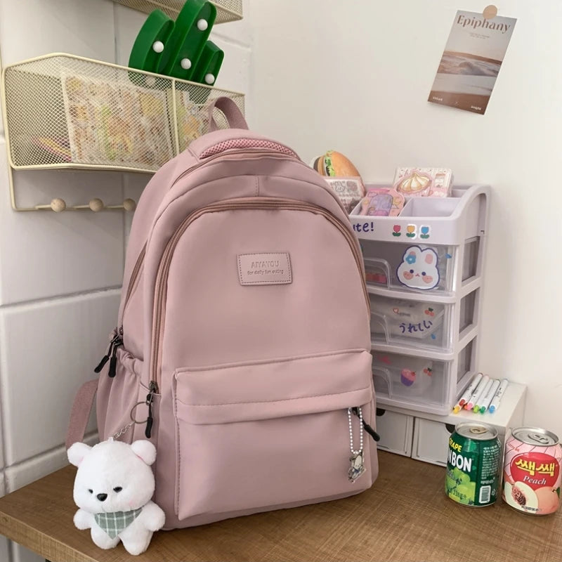 Student Japanese large-capacity backpack Girl simple and versatile backpack Unisex polyester material Doll decoration