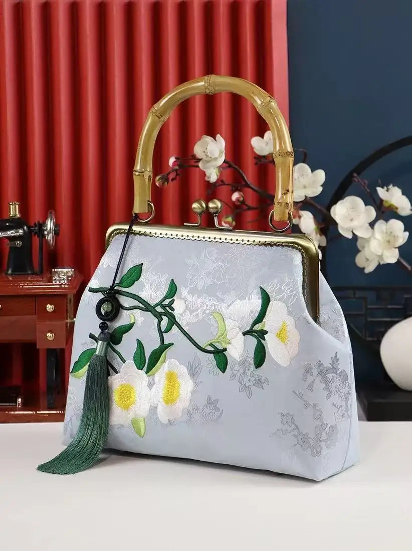 Luxurious and elegant embroidered silk geometric pattern Chinese style bamboo handle gift bag for middle-aged mother with tassel