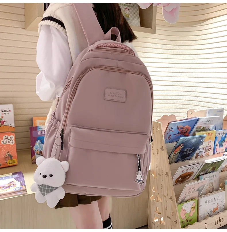 Student Japanese large-capacity backpack Girl simple and versatile backpack Unisex polyester material Doll decoration