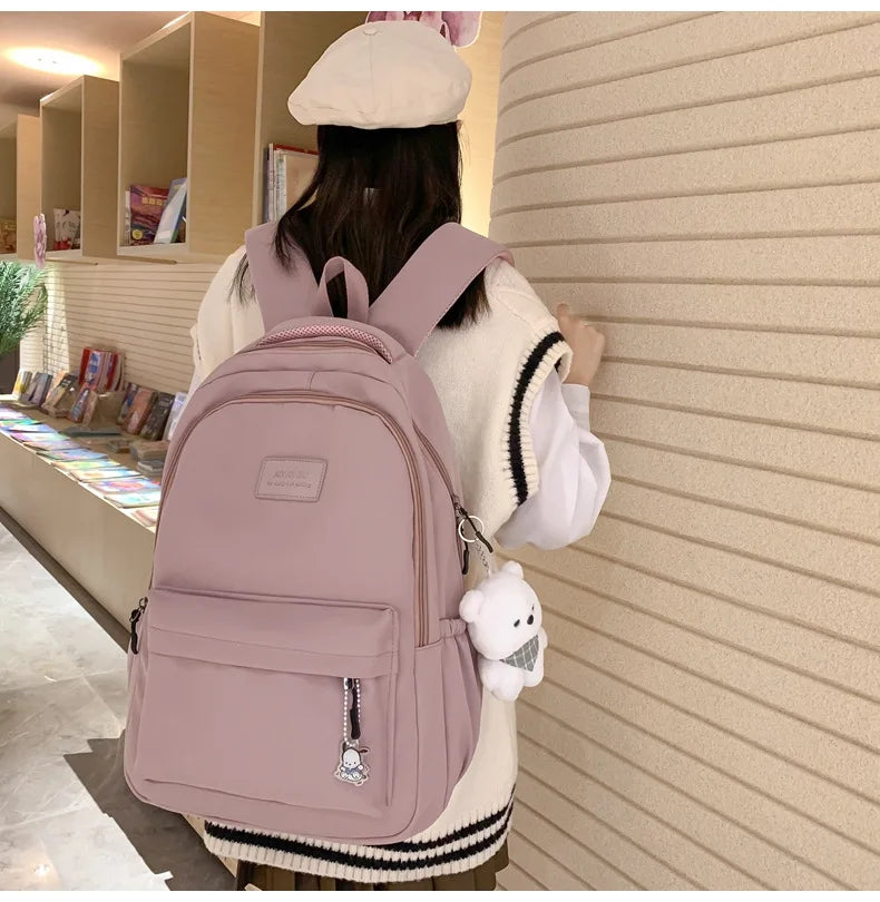 Student Japanese large-capacity backpack Girl simple and versatile backpack Unisex polyester material Doll decoration