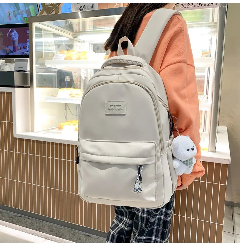 Student Japanese large-capacity backpack Girl simple and versatile backpack Unisex polyester material Doll decoration