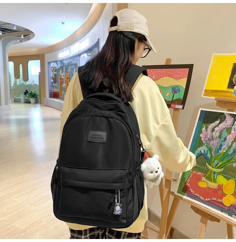 Student Japanese large-capacity backpack Girl simple and versatile backpack Unisex polyester material Doll decoration