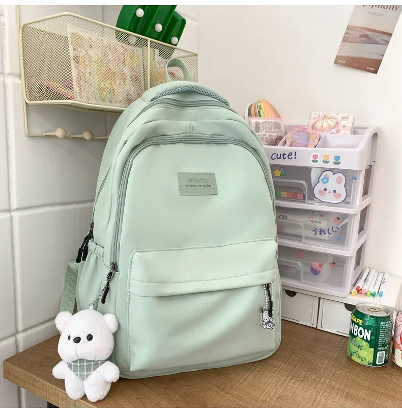 Student Japanese large-capacity backpack Girl simple and versatile backpack Unisex polyester material Doll decoration