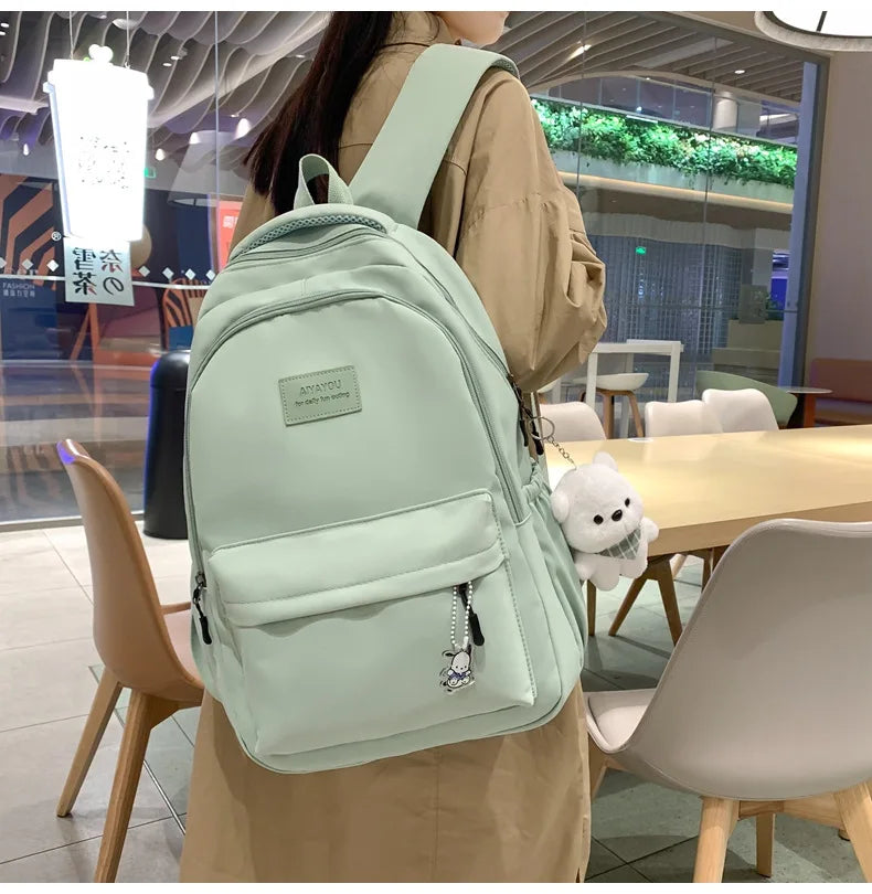 Student Japanese large-capacity backpack Girl simple and versatile backpack Unisex polyester material Doll decoration