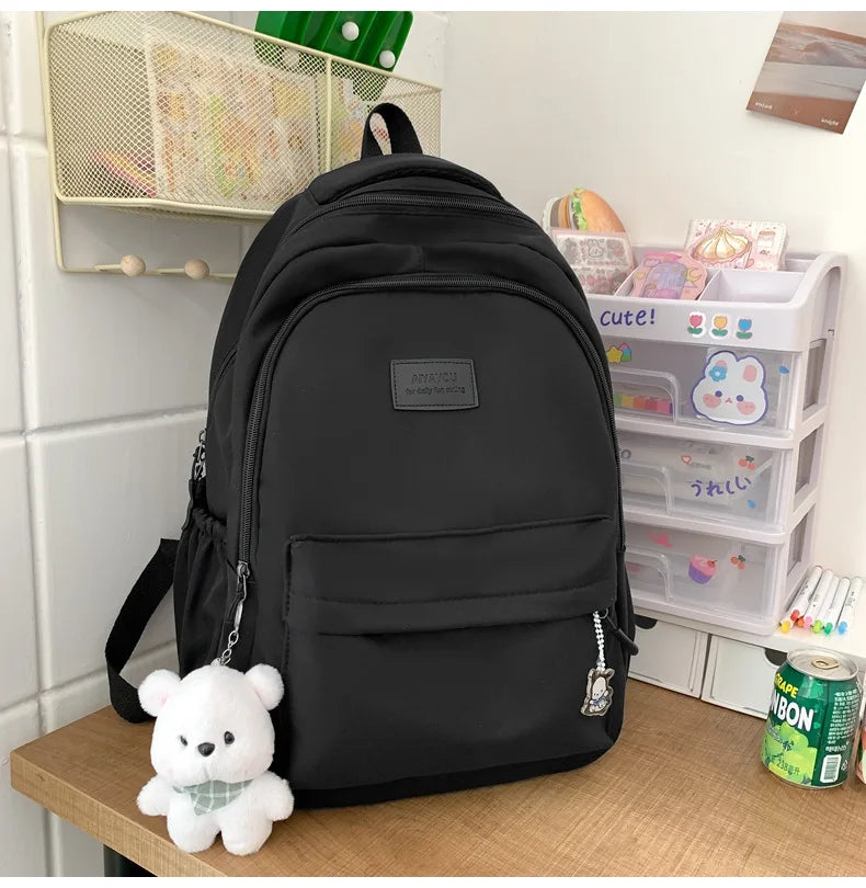 Student Japanese large-capacity backpack Girl simple and versatile backpack Unisex polyester material Doll decoration