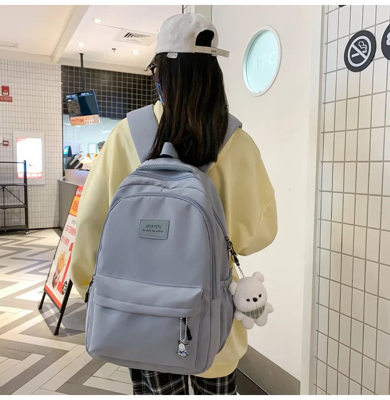Student Japanese large-capacity backpack Girl simple and versatile backpack Unisex polyester material Doll decoration