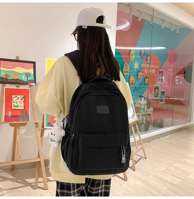 Student Japanese large-capacity backpack Girl simple and versatile backpack Unisex polyester material Doll decoration