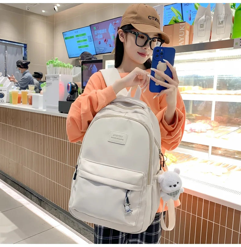 Student Japanese large-capacity backpack Girl simple and versatile backpack Unisex polyester material Doll decoration
