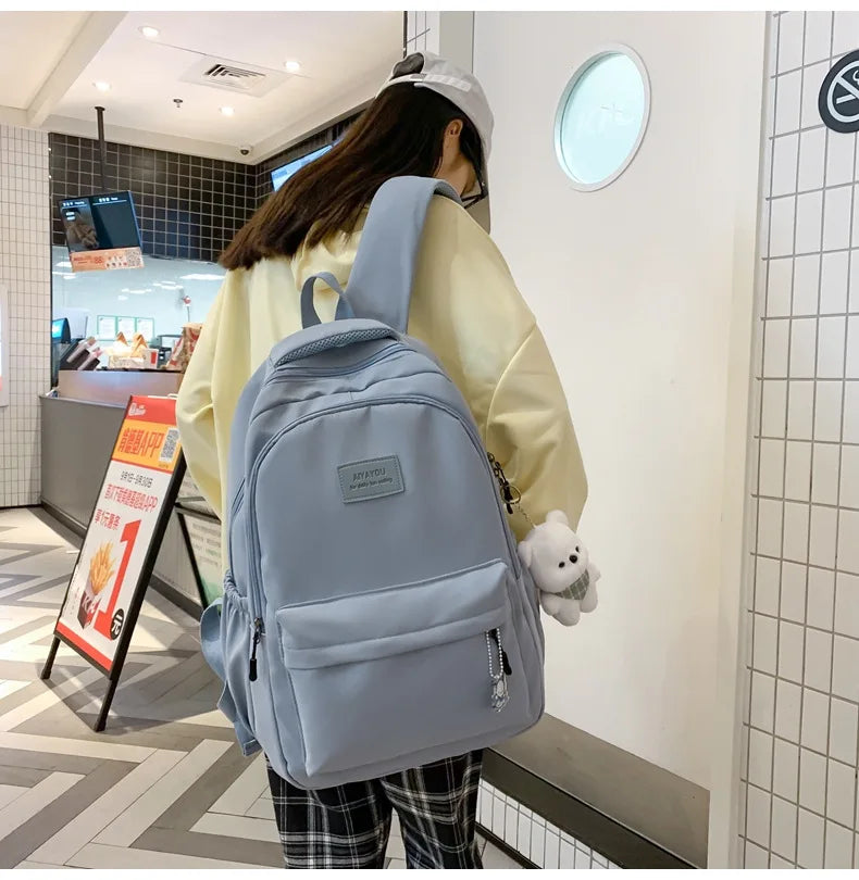 Student Japanese large-capacity backpack Girl simple and versatile backpack Unisex polyester material Doll decoration