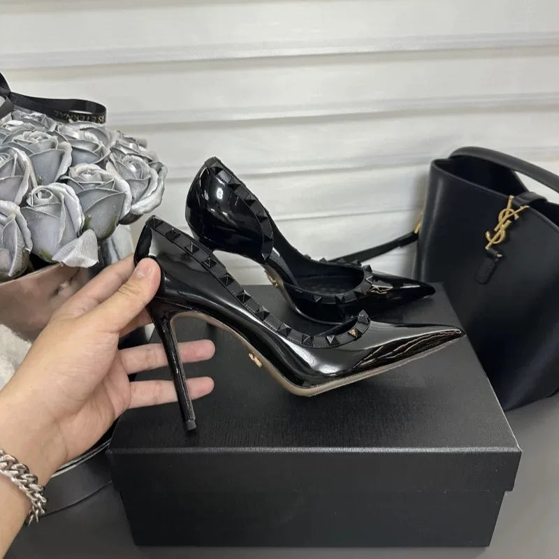 White high heels female 2025 spring and summer new side empty pointed rivets matching sexy slim heel shallow mouth single shoes