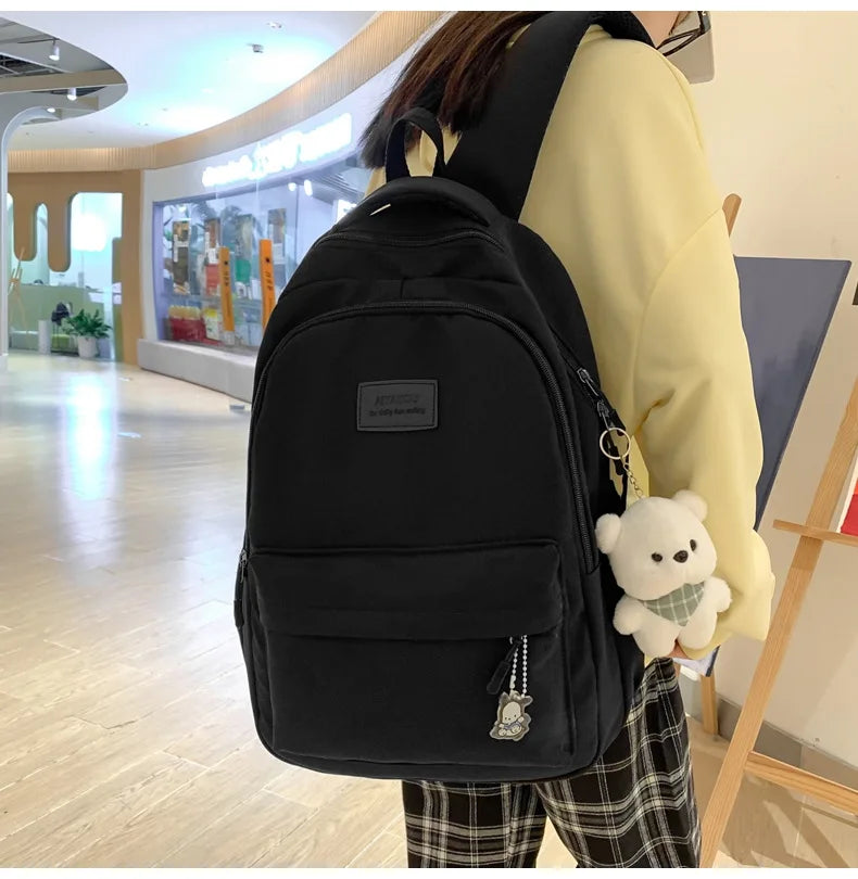 Student Japanese large-capacity backpack Girl simple and versatile backpack Unisex polyester material Doll decoration