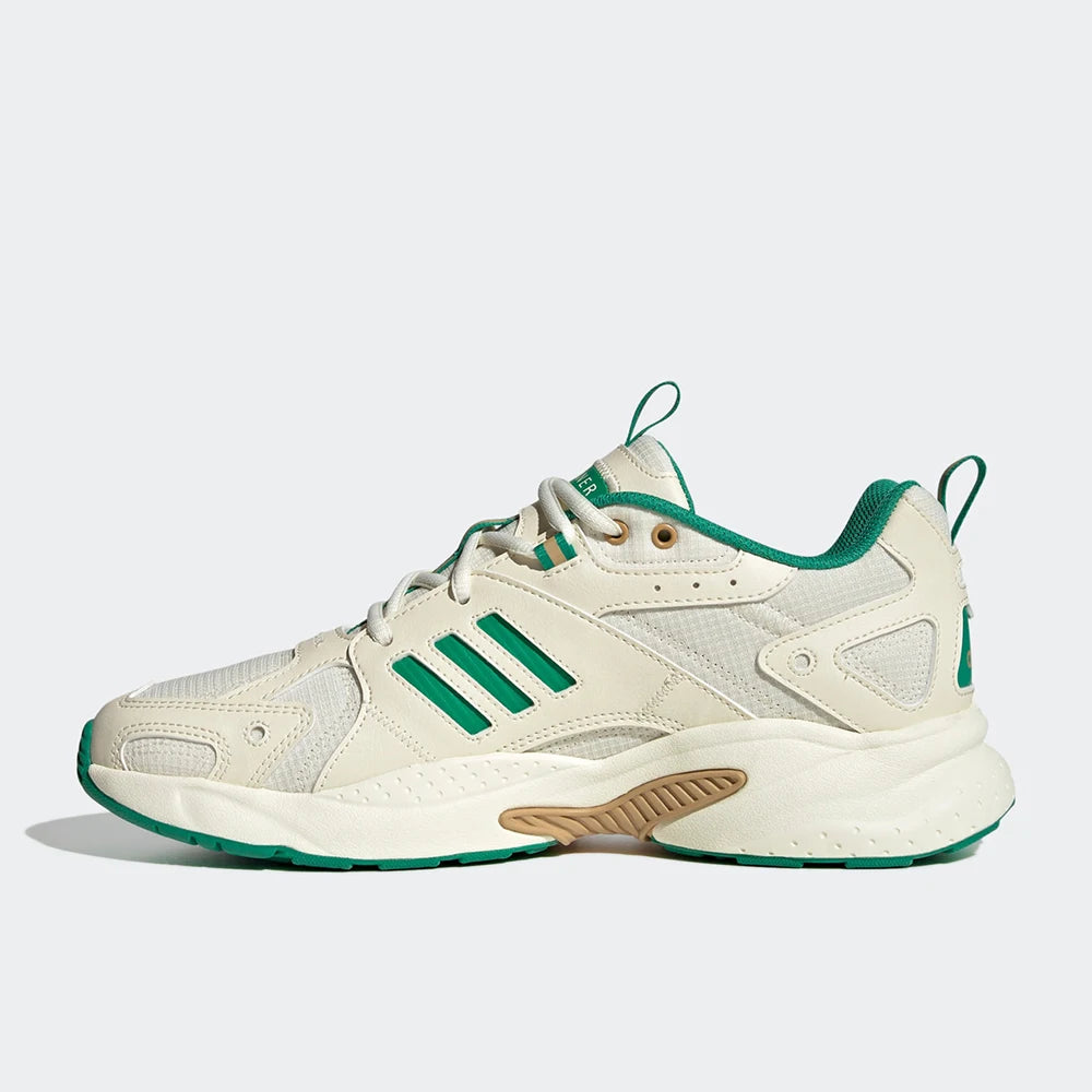 White sneaker with green accents on a white background