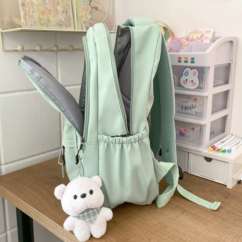 Student Japanese large-capacity backpack Girl simple and versatile backpack Unisex polyester material Doll decoration