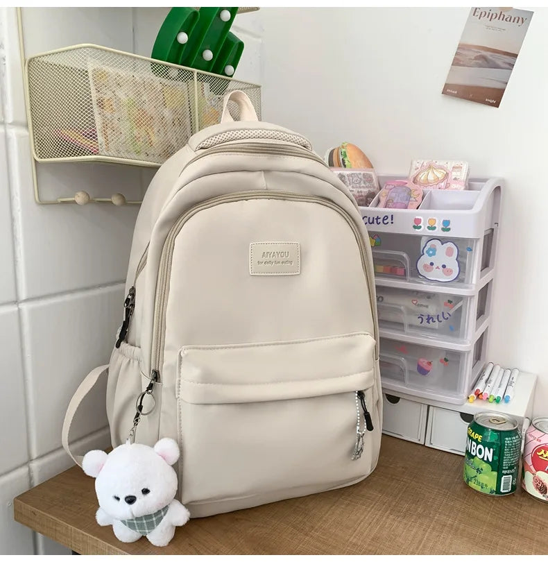 Student Japanese large-capacity backpack Girl simple and versatile backpack Unisex polyester material Doll decoration
