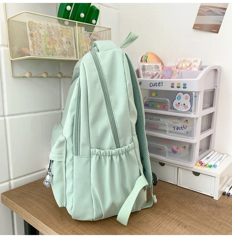 Student Japanese large-capacity backpack Girl simple and versatile backpack Unisex polyester material Doll decoration
