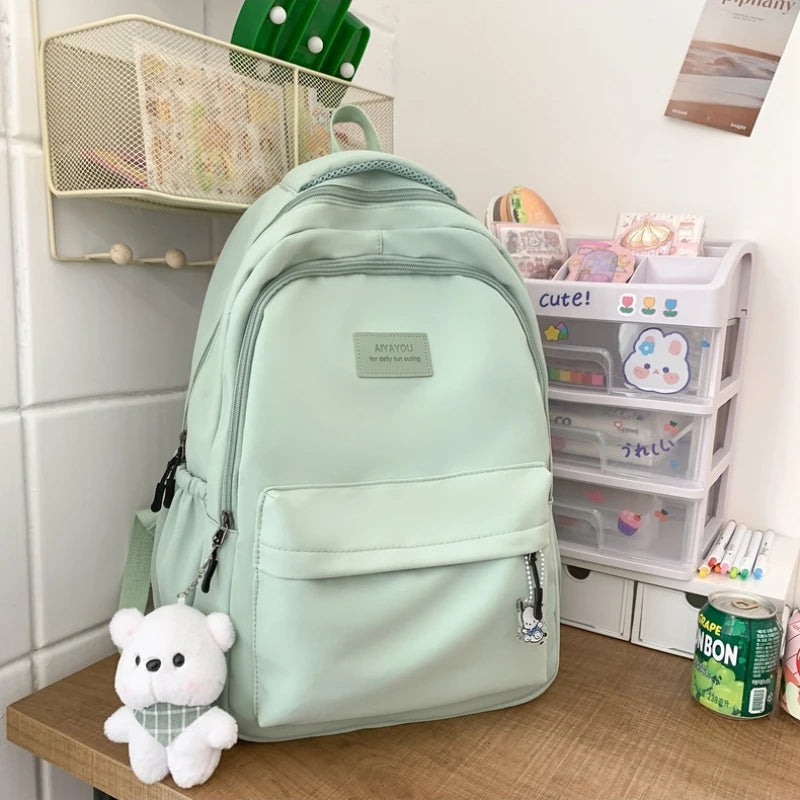 Student Japanese large-capacity backpack Girl simple and versatile backpack Unisex polyester material Doll decoration