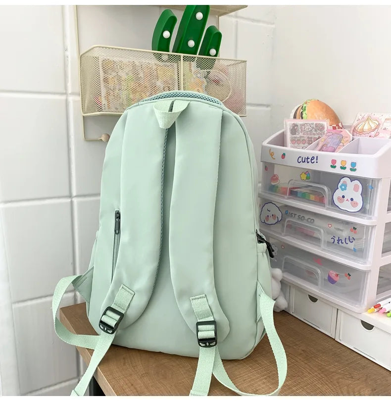 Student Japanese large-capacity backpack Girl simple and versatile backpack Unisex polyester material Doll decoration