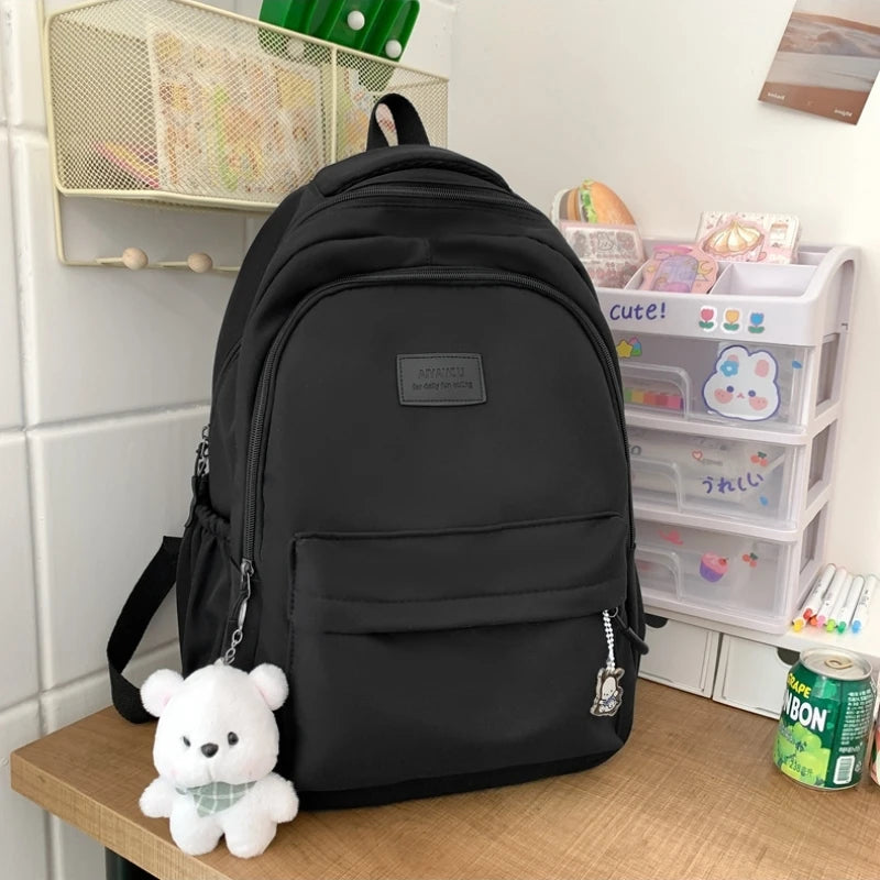 Student Japanese large-capacity backpack Girl simple and versatile backpack Unisex polyester material Doll decoration