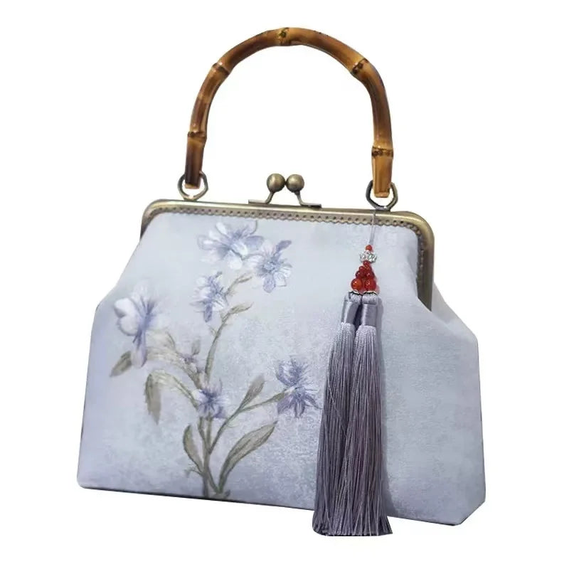 Luxurious and elegant embroidered silk geometric pattern Chinese style bamboo handle gift bag for middle-aged mother with tassel