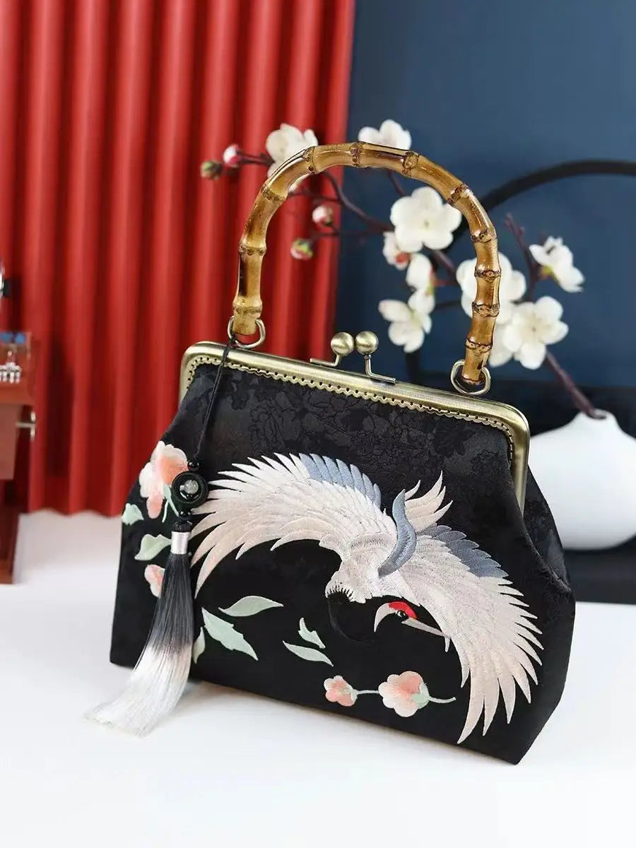 Luxurious and elegant embroidered silk geometric pattern Chinese style bamboo handle gift bag for middle-aged mother with tassel