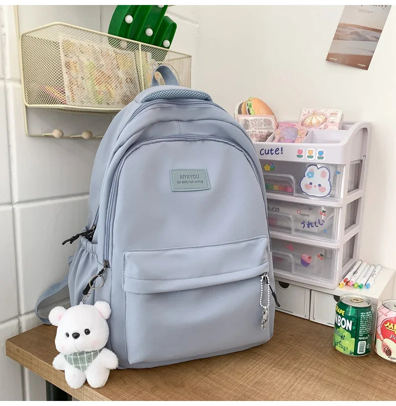 Student Japanese large-capacity backpack Girl simple and versatile backpack Unisex polyester material Doll decoration