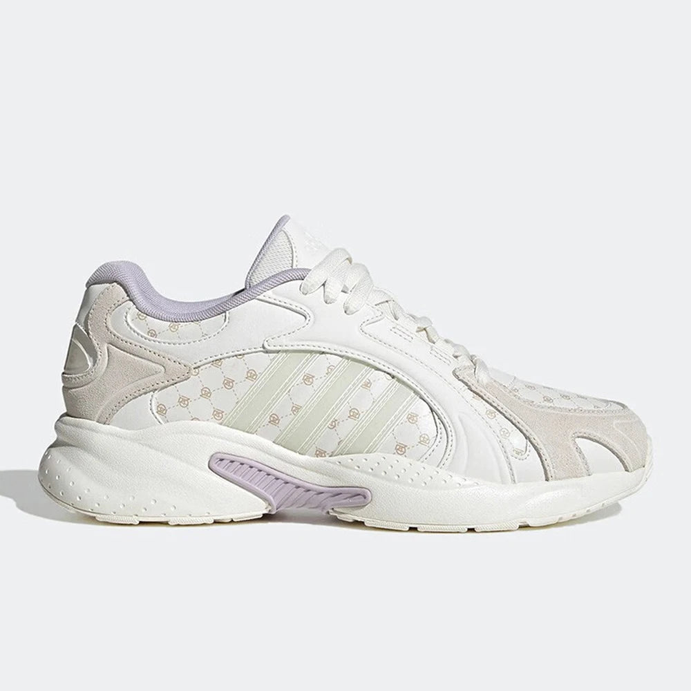 White athletic shoe with purple accents on a light gray background
