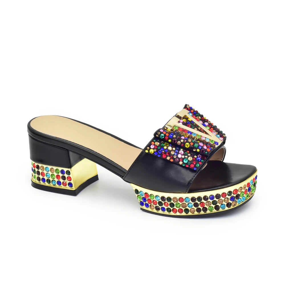 Multicolored embellished sandal on a white background