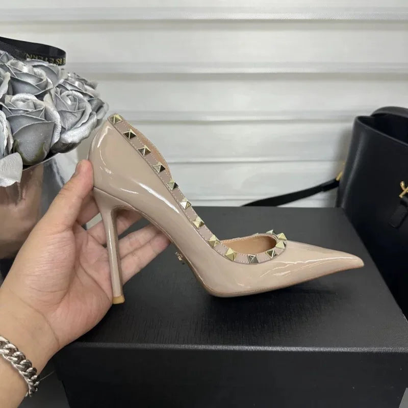 White high heels female 2025 spring and summer new side empty pointed rivets matching sexy slim heel shallow mouth single shoes