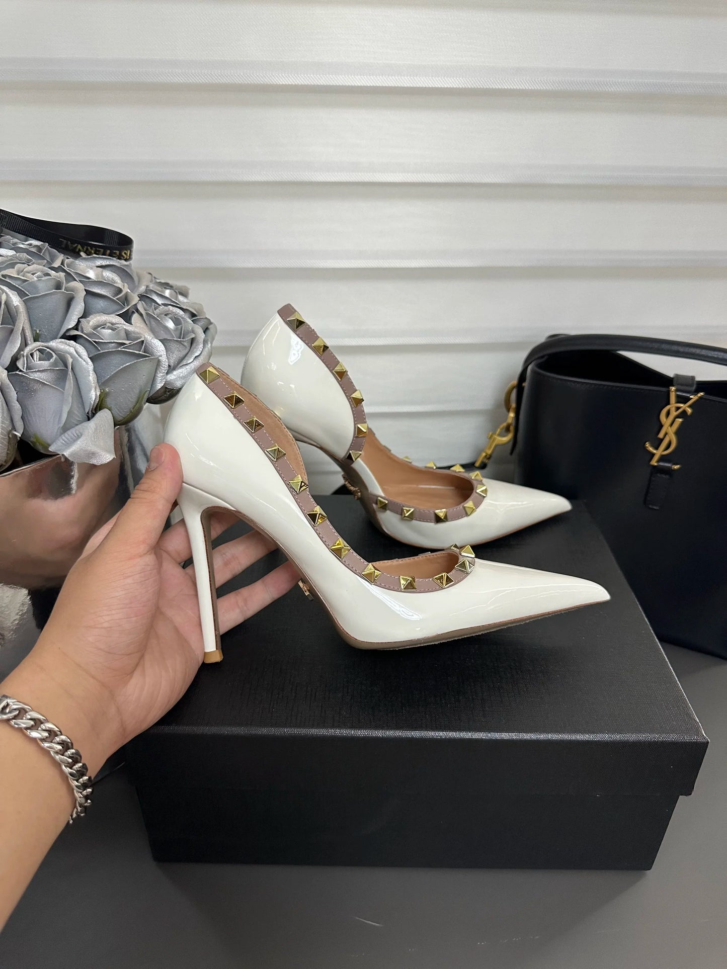 White high heels female 2025 spring and summer new side empty pointed rivets matching sexy slim heel shallow mouth single shoes