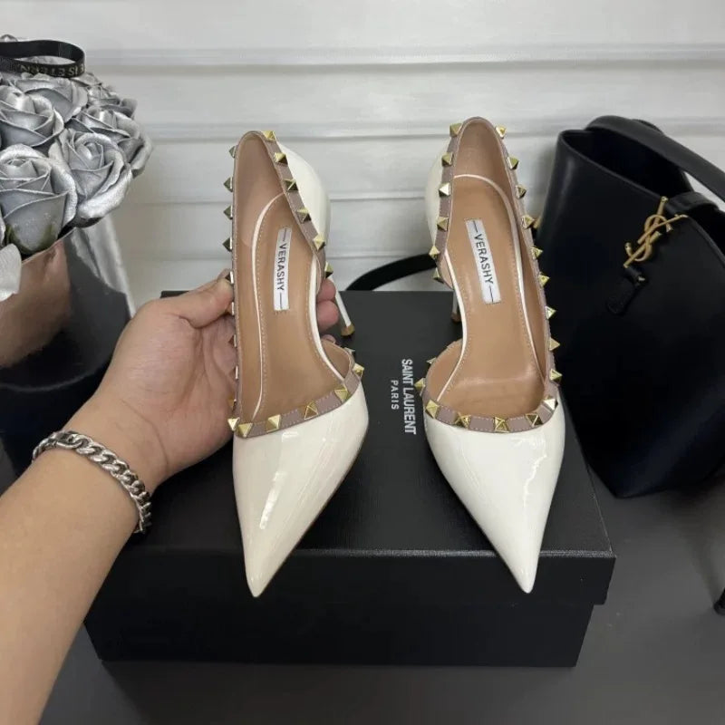 White high heels female 2025 spring and summer new side empty pointed rivets matching sexy slim heel shallow mouth single shoes
