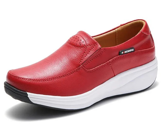 Red shoe with white sole on a white background.