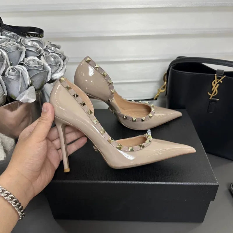 White high heels female 2025 spring and summer new side empty pointed rivets matching sexy slim heel shallow mouth single shoes
