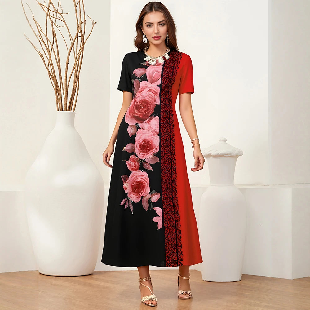 Woman wearing a black and red floral dress in a minimalistic setting