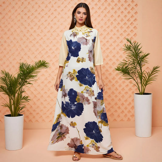 Woman wearing a floral dress with a geometric patterned wall and plants in the background