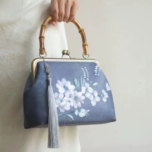 Luxurious and elegant embroidered silk geometric pattern Chinese style bamboo handle gift bag for middle-aged mother with tassel