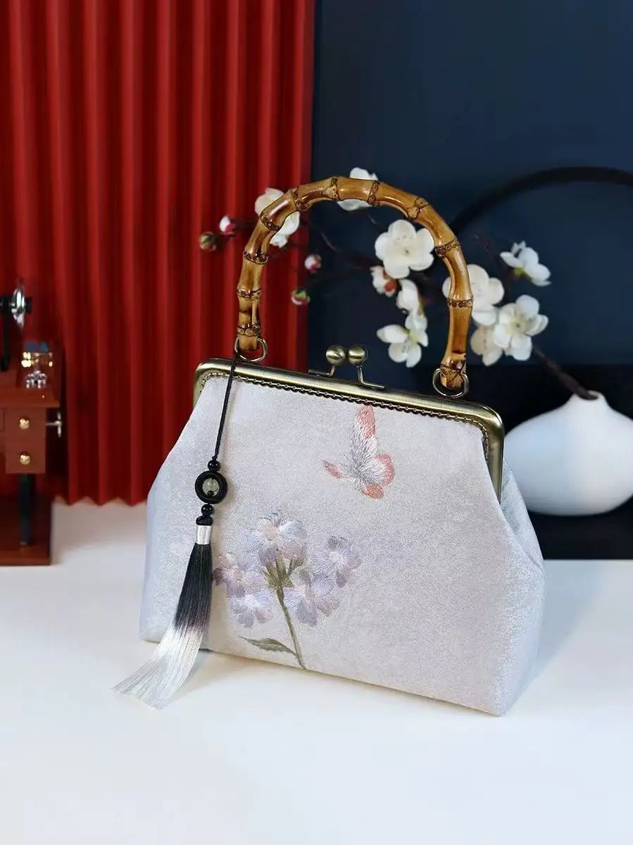 Luxurious and elegant embroidered silk geometric pattern Chinese style bamboo handle gift bag for middle-aged mother with tassel